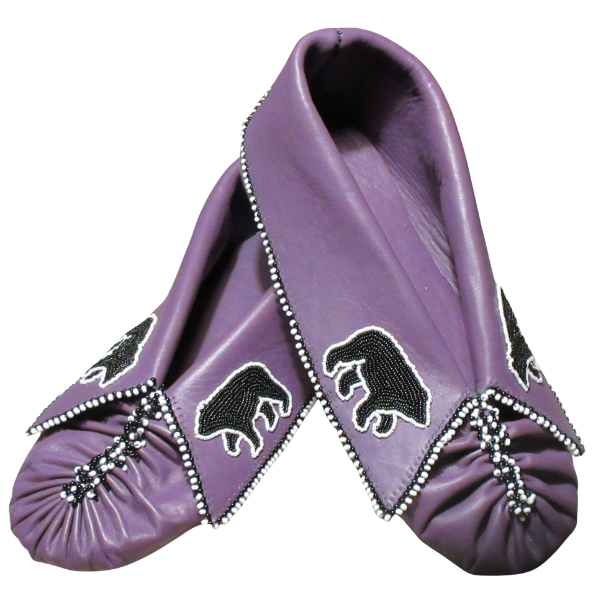 A pair of purple moccasins decorated with black bear designs and white bead accents along the edges and around the toe area.