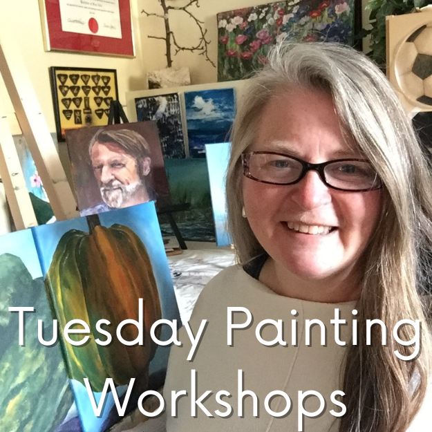 Artist and instructor Rachel Harbour in front of her easel in her studio, surrounded by paintings.